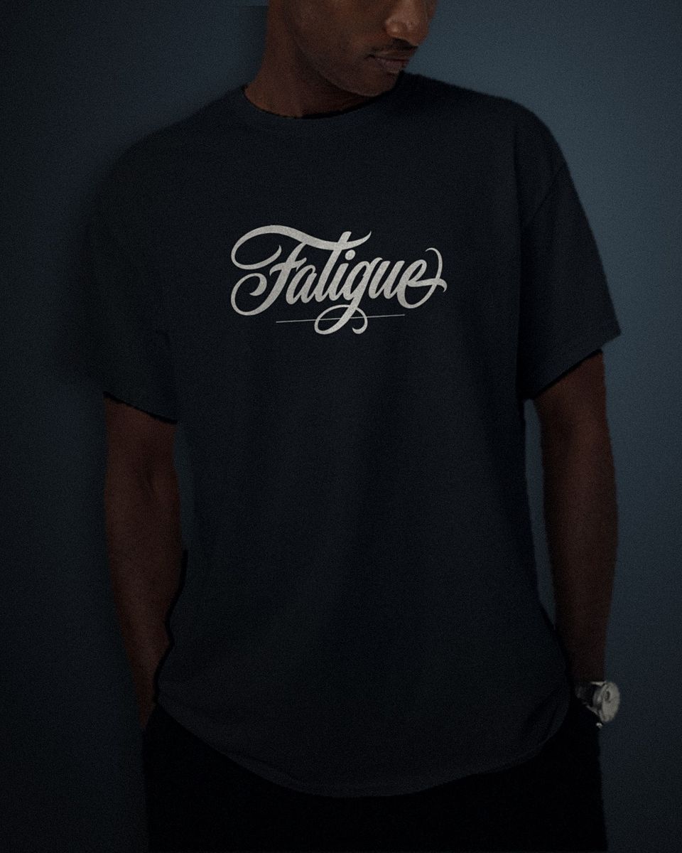 Copperplate Script tee in black, white full chest print, worn by a model