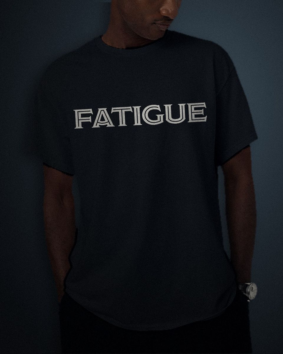 Deco Inline tee in black, white full chest print, worn by a model