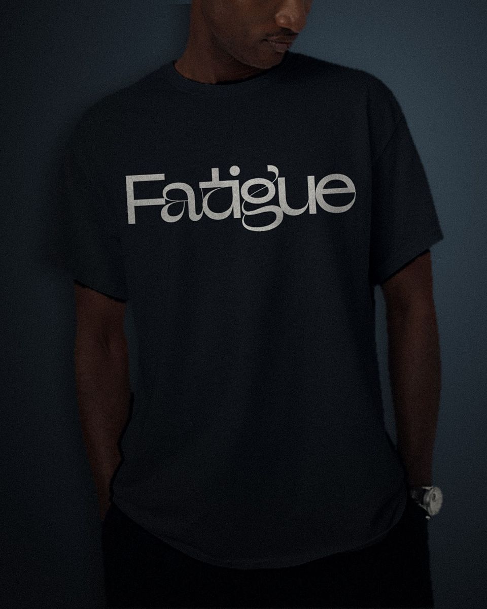 Geometric Ligature tee in black, white full chest print, worn by a model