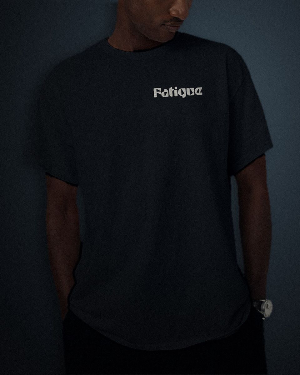 Heavy Block tee in black, white left chest print, worn by a model